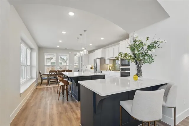 a dining room with furniture and wooden floor