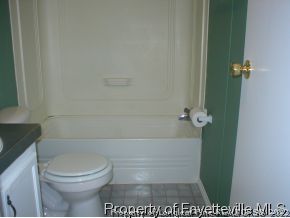 8267 Godwin-Falcon Road Godwin, NC 28344 - Photo 8 of 10 a bathroom with a toilet and a shower