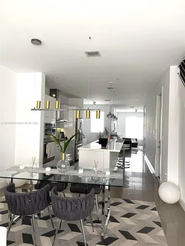 a living room with large window and a couch