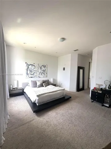 a large bathroom with a sink a large mirror and a shower