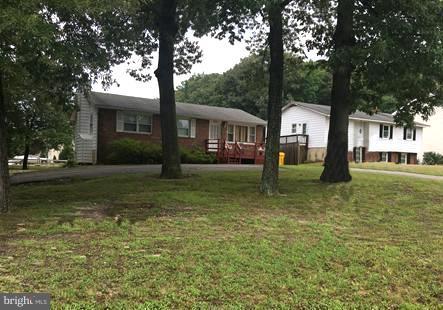 8262 WB&A Road Severn, MD 21144 - Photo 1 of 22 a front view of a house with garden