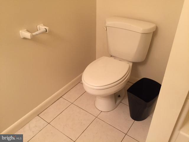 8262 WB&A Road Severn, MD 21144 - Photo 19 of 22 a white toilet sitting next to a shower