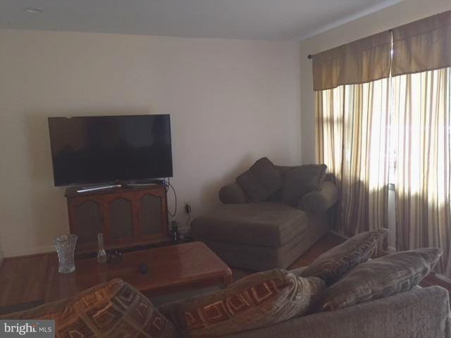 8262 WB&A Road Severn, MD 21144 - Photo 5 of 22 a living room with furniture and a flat screen tv