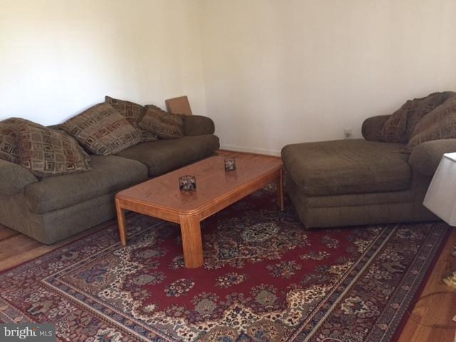8262 WB&A Road Severn, MD 21144 - Photo 8 of 22 a living room with furniture and a rug