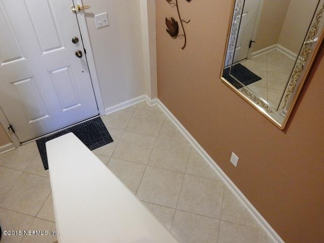 12962 Spring Rain Road Jacksonville, FL 32258 - Photo 3 of 32 a bathroom with a sink and a mirror