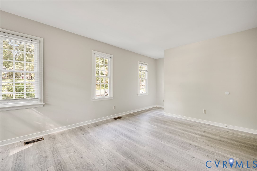 4820 Cedar Cliff Road Chester, VA 23831 - Photo 31 of 41 Light-toned wood-finish flooring, multiple windows