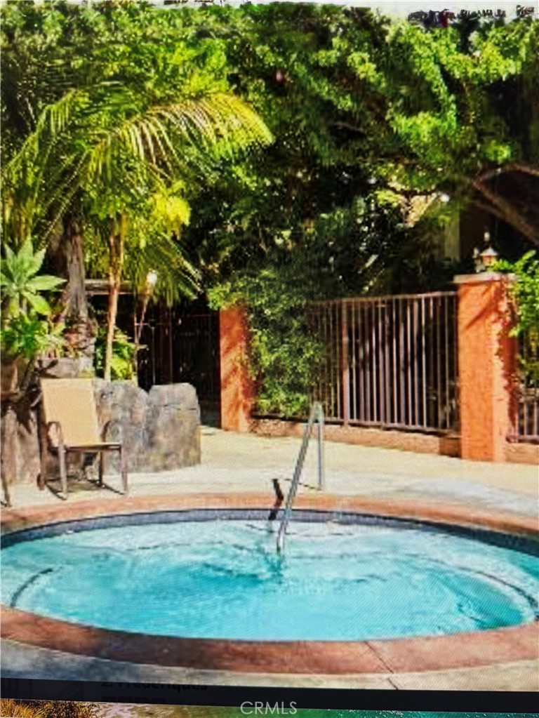 7667 Stage Road, Unit 90 La Mirada, CA 90621 - Photo 9 of 11 a backyard of a house with lots of green space