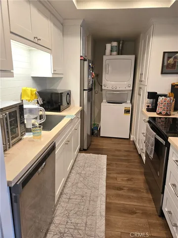 a kitchen with a sink stove and refrigerator