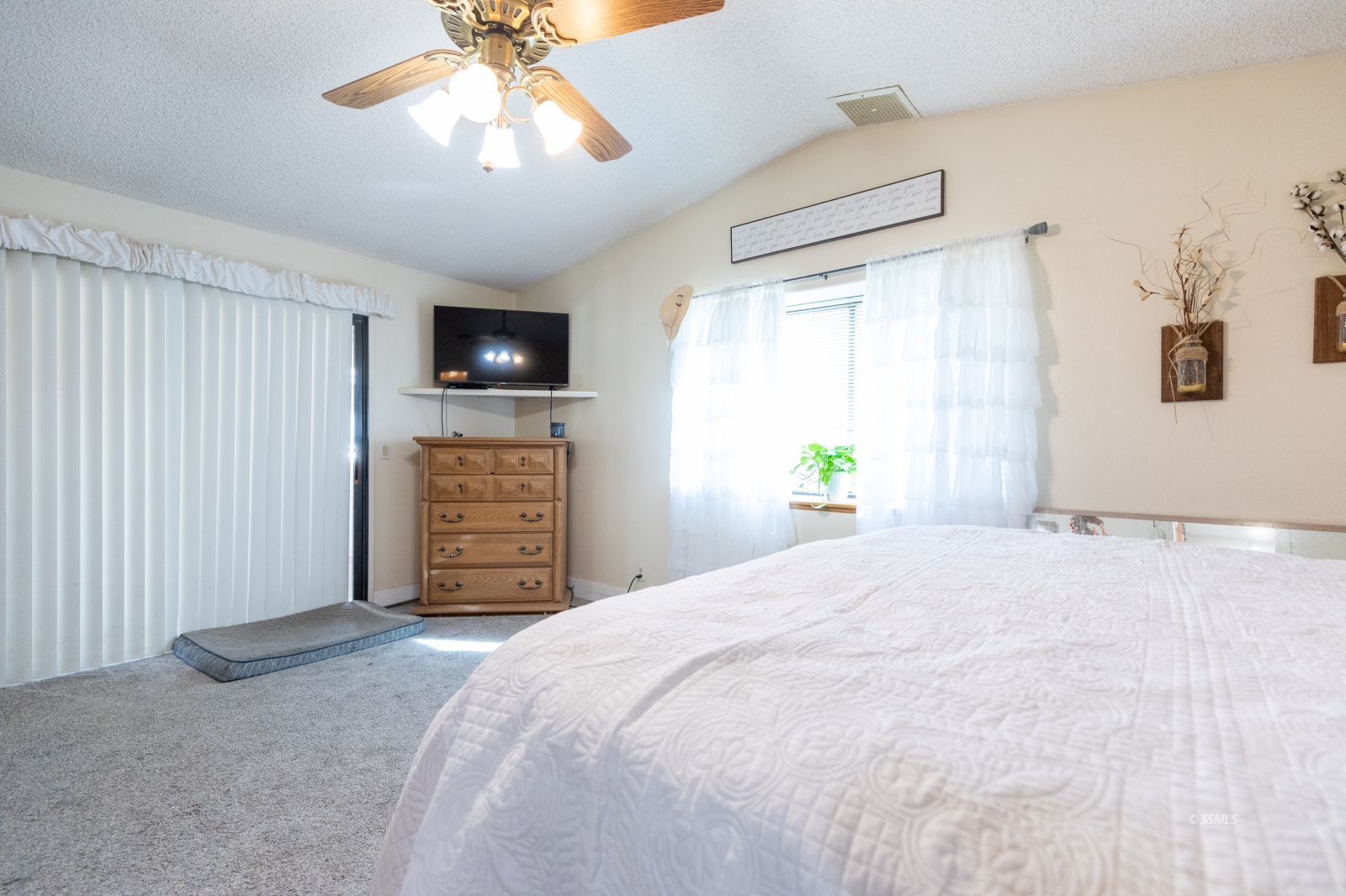 135 Brown Road Inyokern, CA 93527 - Photo 25 of 46 a bedroom with a bed and a flat screen tv