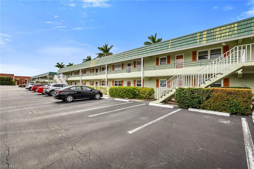 200 Valley Stream Drive, Unit 3B Naples, FL 34113 - Photo 29 of 45 a car parked in front of a building