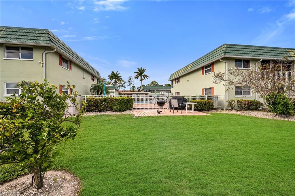 200 Valley Stream Drive, Unit 3B Naples, FL 34113 - Photo 35 of 45 a view of a house with a yard