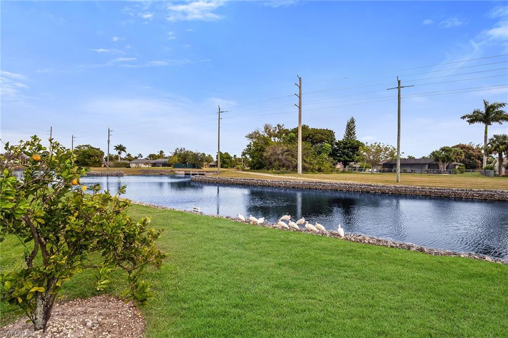 200 Valley Stream Drive, Unit 3B Naples, FL 34113 - Photo 38 of 45 a view of a lake with boats in the background