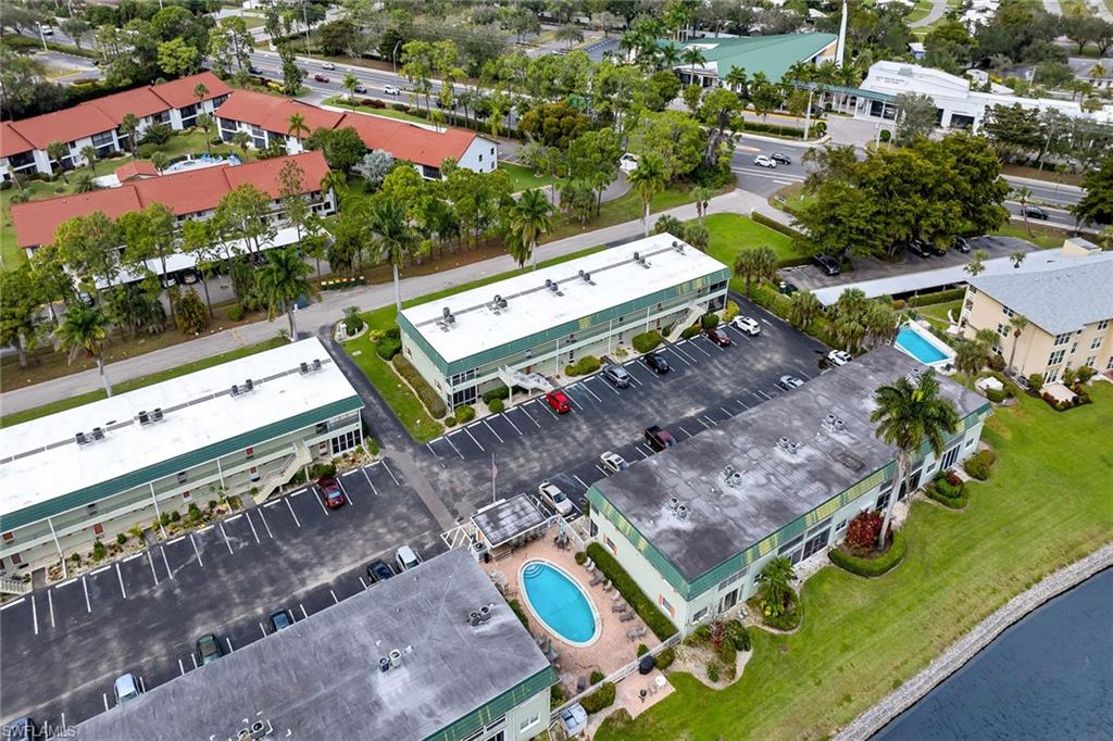 200 Valley Stream Drive, Unit 3B Naples, FL 34113 - Photo 39 of 45 an aerial view of a chairs and table on the terrace