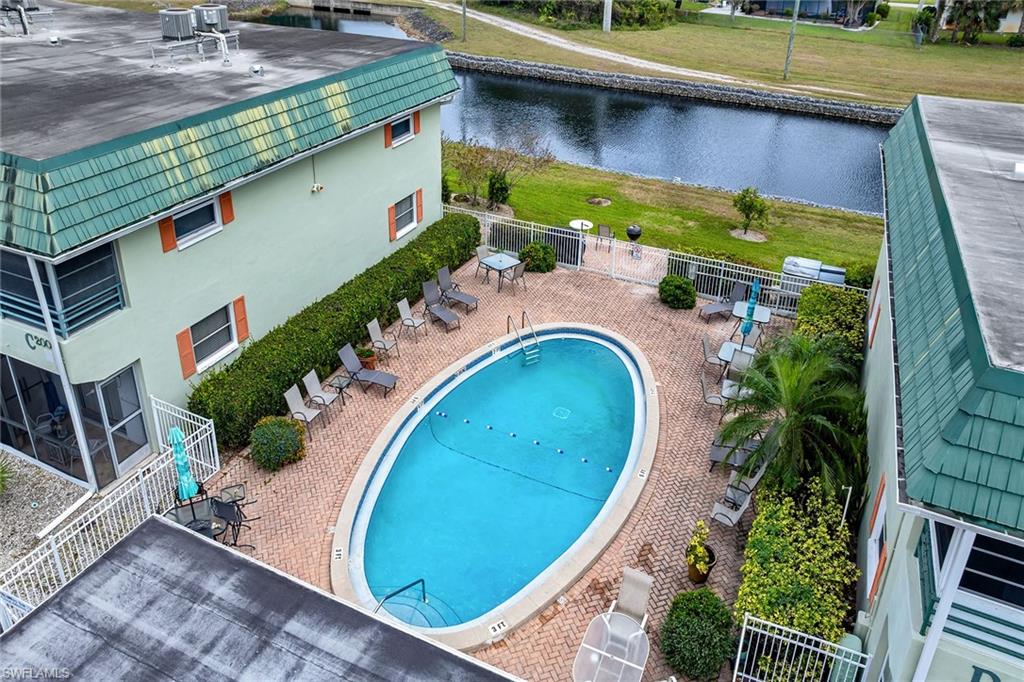 200 Valley Stream Drive, Unit 3B Naples, FL 34113 - Photo 42 of 45 an aerial view of a house with a swimming pool