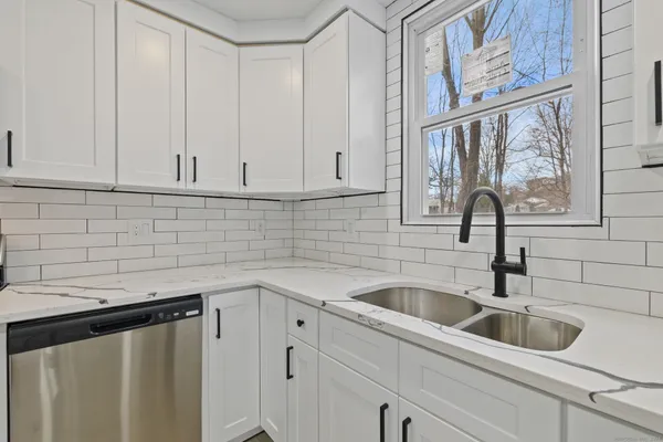 a kitchen with a sink and cabinets