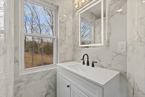 a bathroom with a sink and a mirror