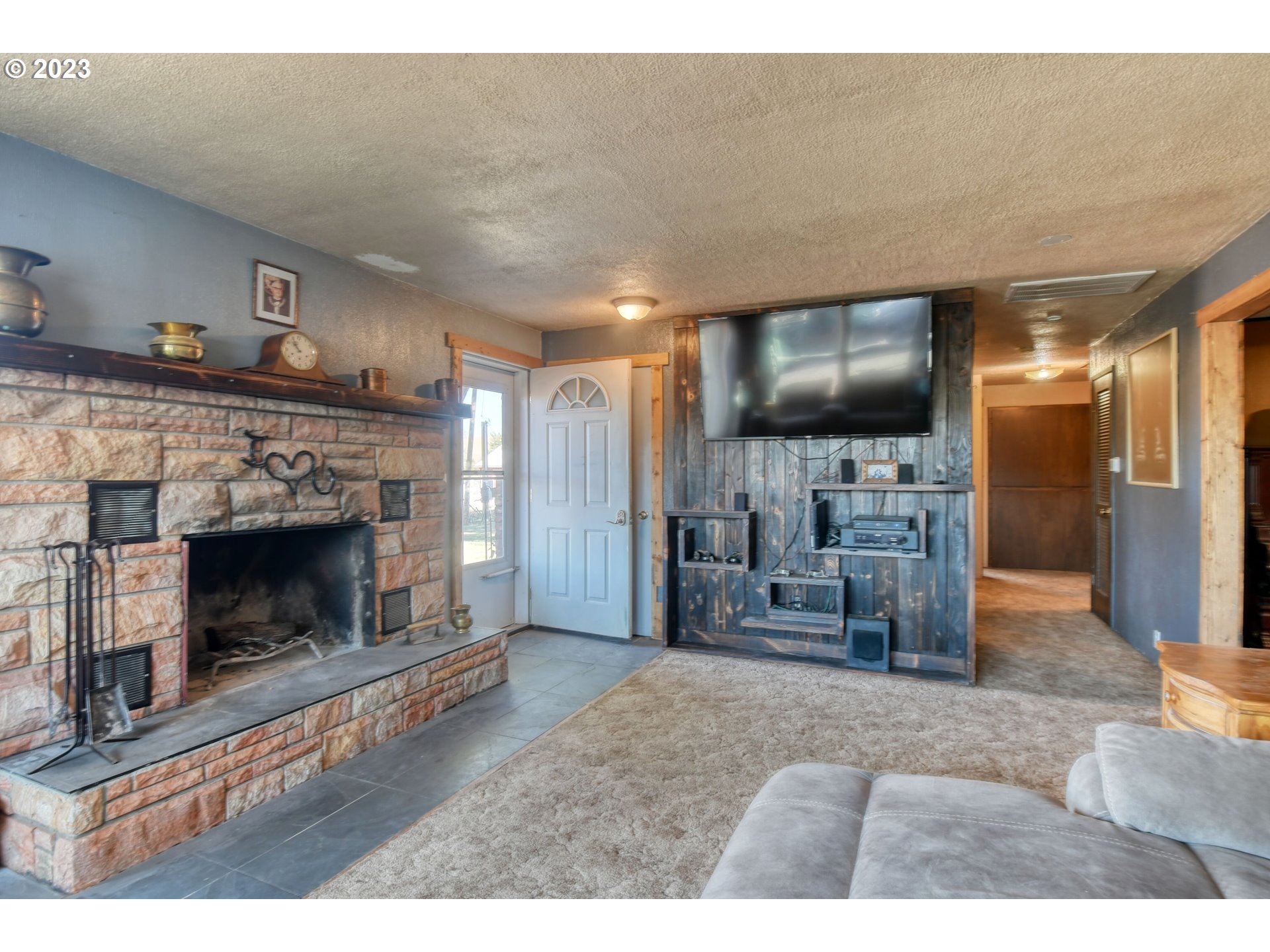 73559 Hart Lane Pendleton, OR 97801 - Photo 12 of 47 a living room with furniture and a fireplace
