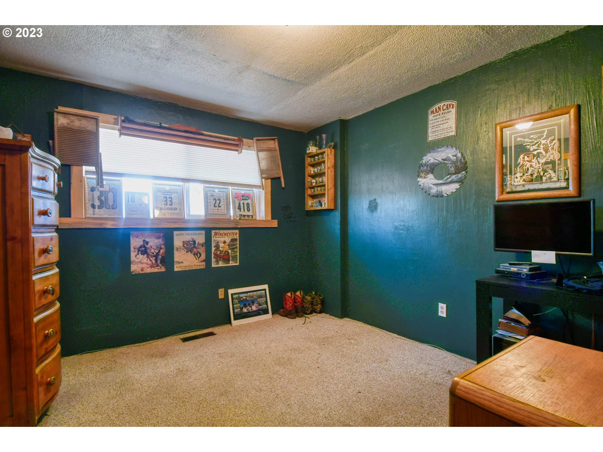 73559 Hart Lane Pendleton, OR 97801 - Photo 28 of 47 a bedroom with a bed and a bookshelf