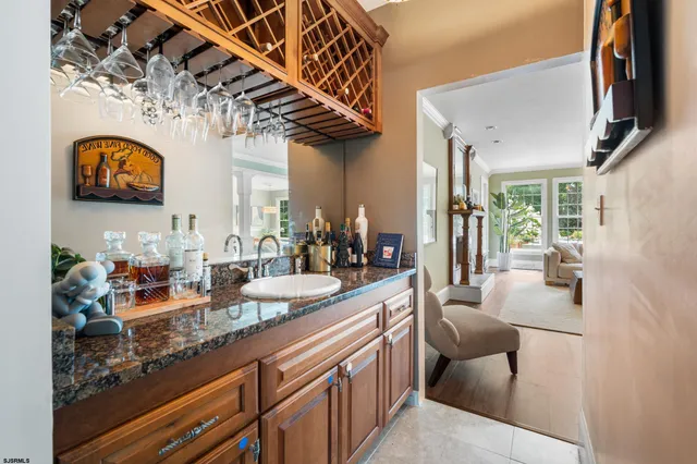 a hallway with sink and mirror