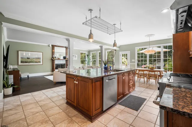 a kitchen with stainless steel appliances granite countertop a sink and cabinets