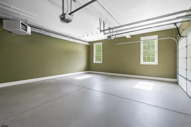 a kitchen with a stove and white cabinets