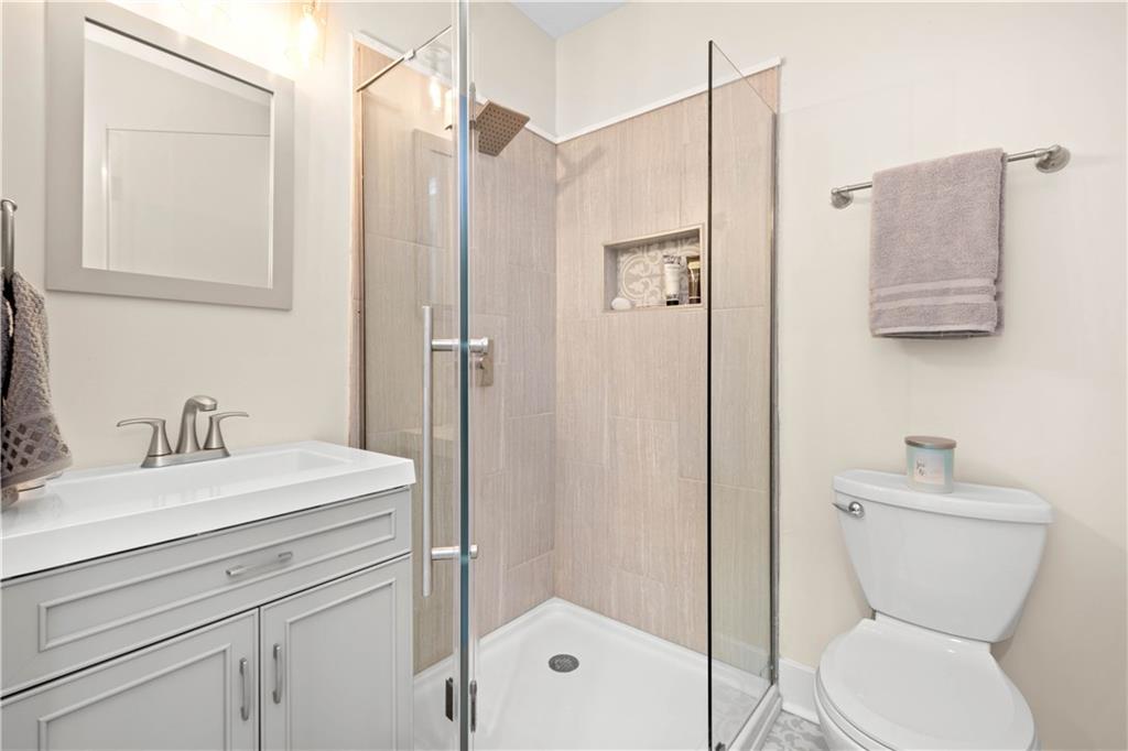 1015 Greentree Road Pittsburgh, PA 15220 - Photo 12 of 25 Master Bath with New Grey Vanity, Walk-In Shower with Glass Doors and Gorgeous Tile Flooring