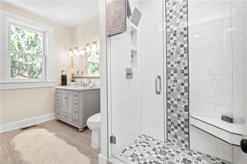 1015 Greentree Road Pittsburgh, PA 15220 - Photo 14 of 25 Hall Bath on the Second Level with Tile Flooring, Oversized Shower with Custom Tile Surround and Rainfall Shower Head