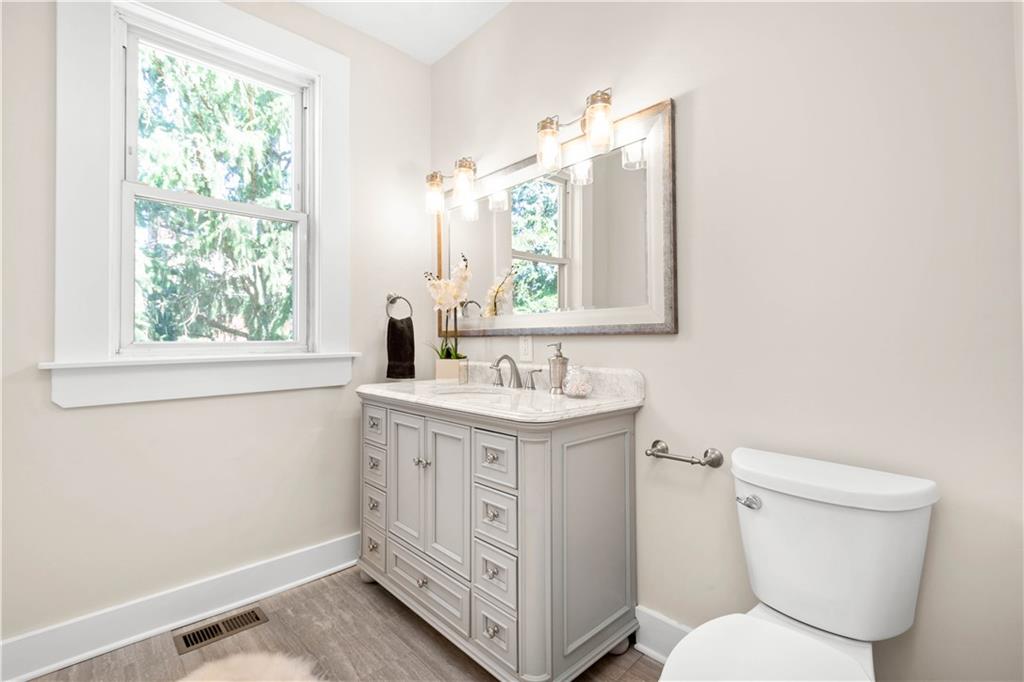 1015 Greentree Road Pittsburgh, PA 15220 - Photo 15 of 25 Lovely Marble Topped Vanity, Decorative Mirror and Beautiful Lighting Complete this Bath