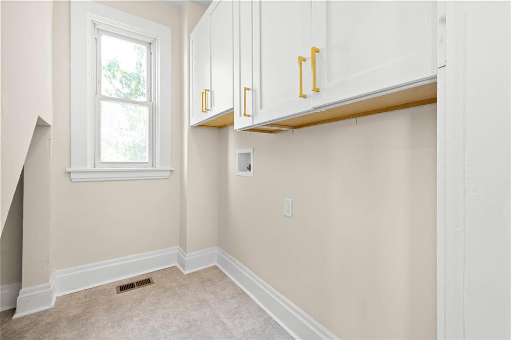 1015 Greentree Road Pittsburgh, PA 15220 - Photo 16 of 25 Second Level Laundry is Highly Convenient. Complete with Storage Cabinets and Lux. Vinyl Flooring