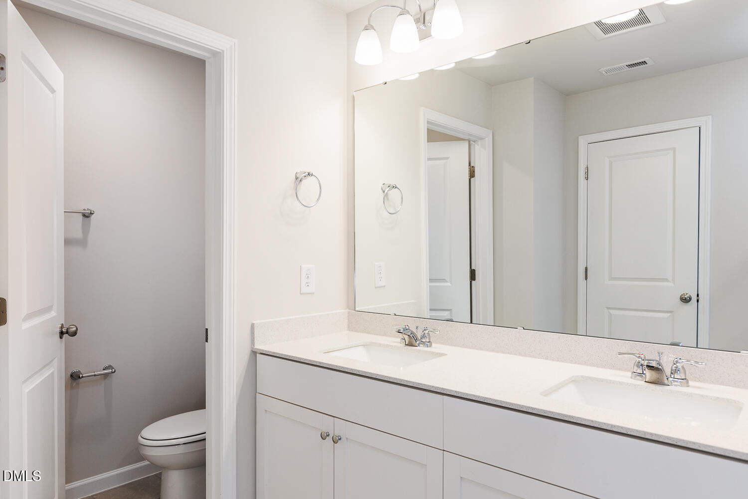 111 Siebold Street Garner, NC 27529 - Photo 17 of 35 a bathroom with a sink a toilet and a mirror