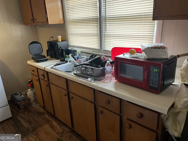 a kitchen with a stove and a sink