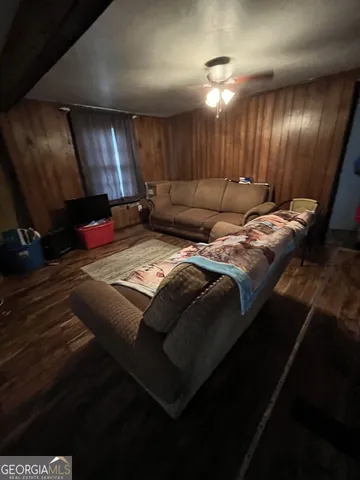 a bed sitting in a room next to a room