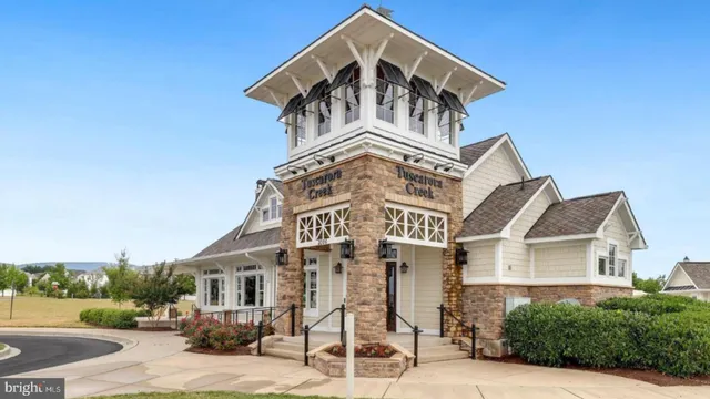 an aerial view of a house with garden space and ocean view