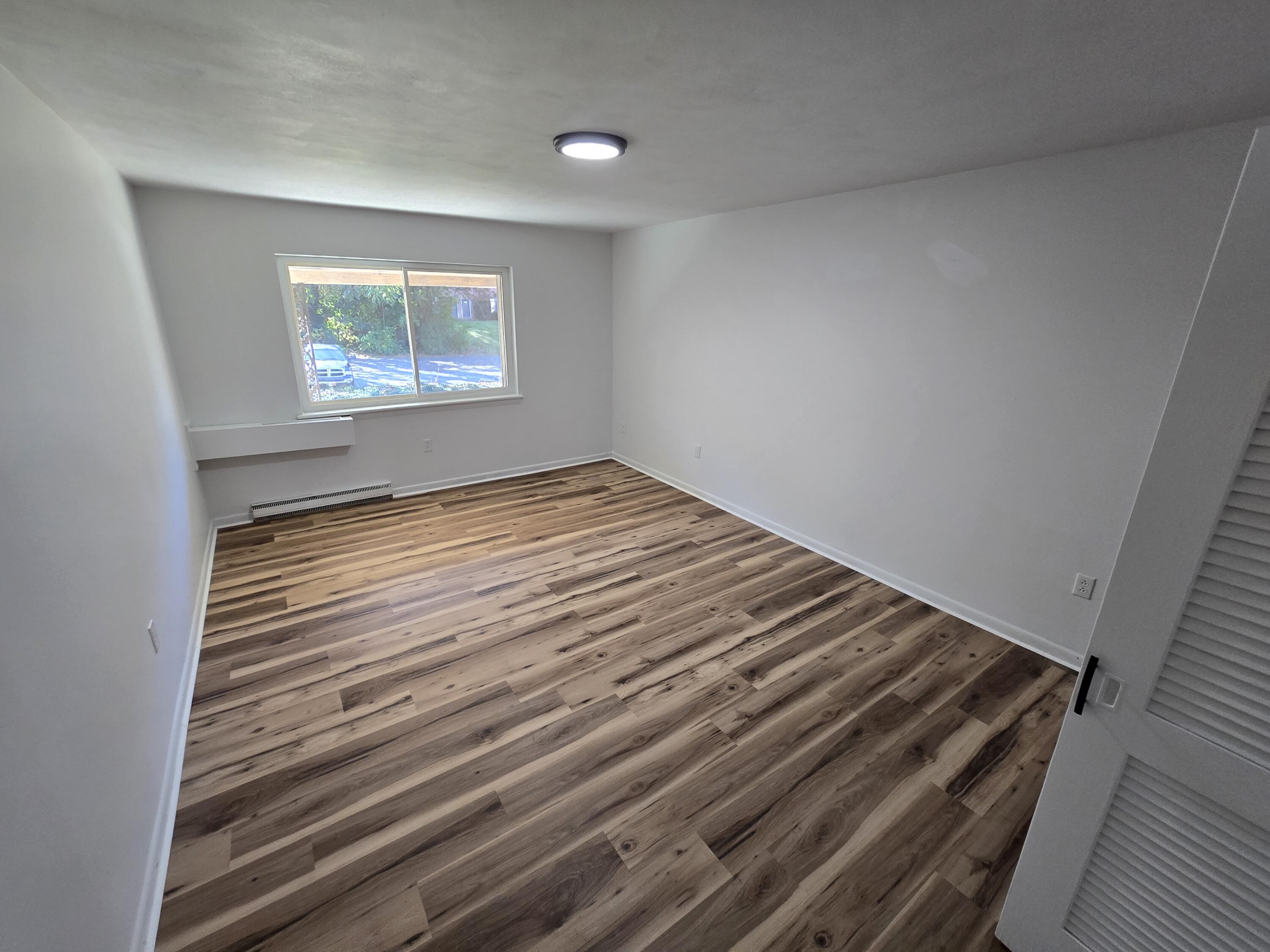 2607 Westover Avenue Southwest, Unit 207 Roanoke, VA 24015 - Photo 7 of 7 a view of an empty room and wooden floor