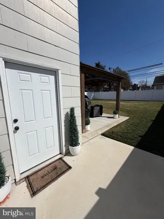 a view of a house with backyard and porch