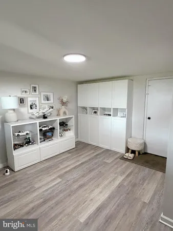 a view of a kitchen with wooden floor