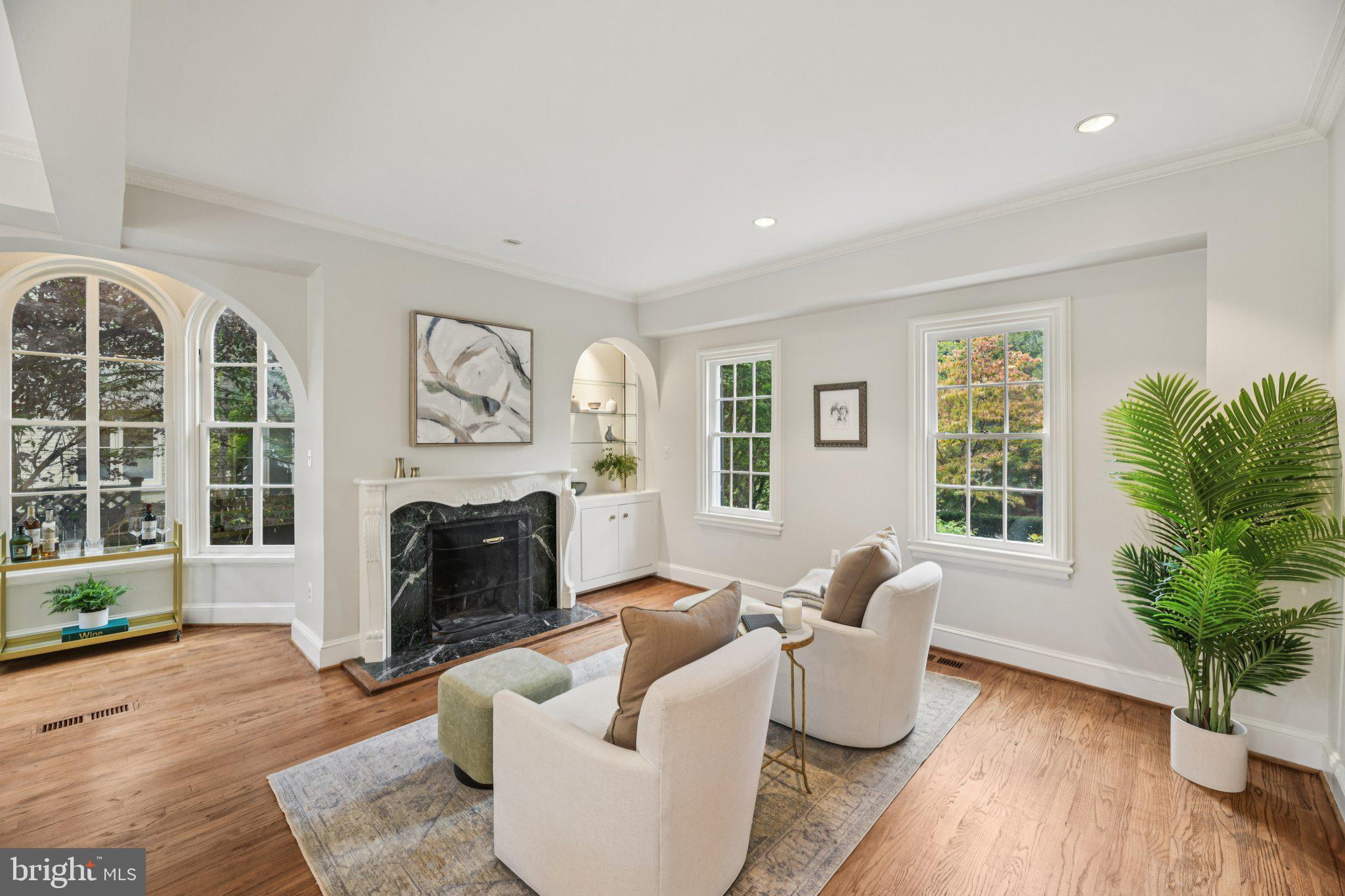1545 35th Street Northwest Washington, DC 20007 - Photo 15 of 65 a living room with furniture and a fireplace