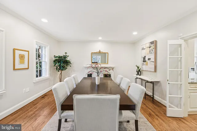 a kitchen with a stove a sink a refrigerator and cabinets
