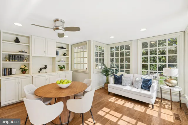 a bedroom with furniture and a wooden floor
