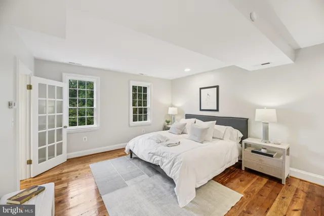 a bathroom with a tub a toilet and a shower