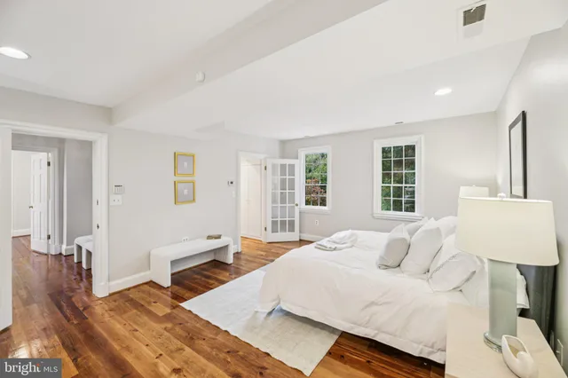 a bedroom with a bed and a fireplace