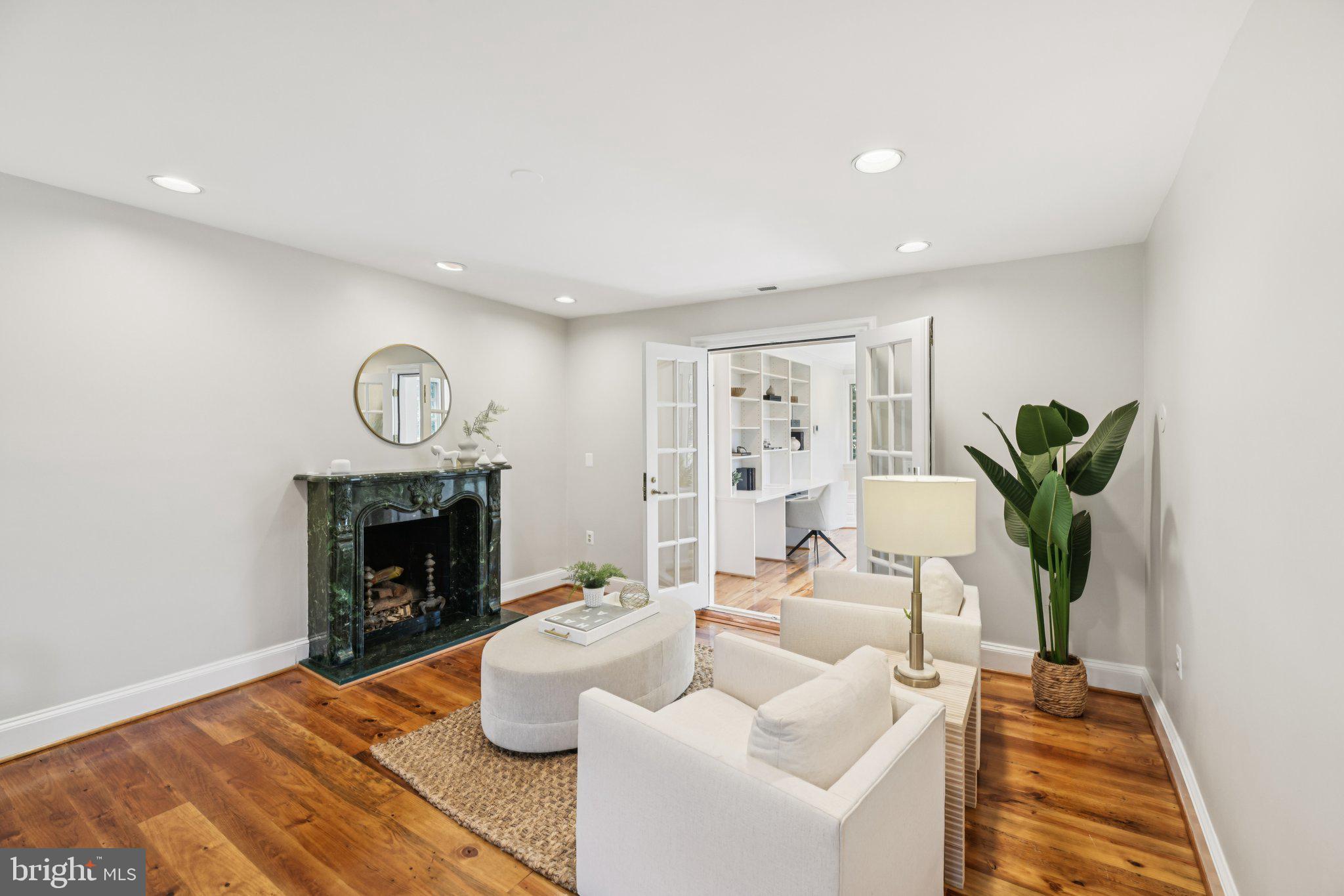1545 35th Street Northwest Washington, DC 20007 - Photo 33 of 65 a living room with furniture and a fireplace