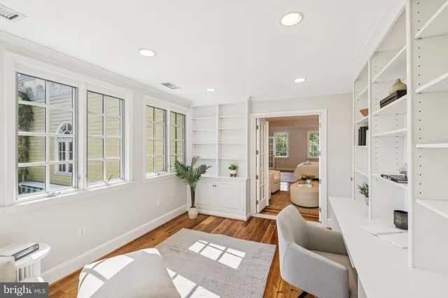 a view of an entryway with wooden floor and stairs