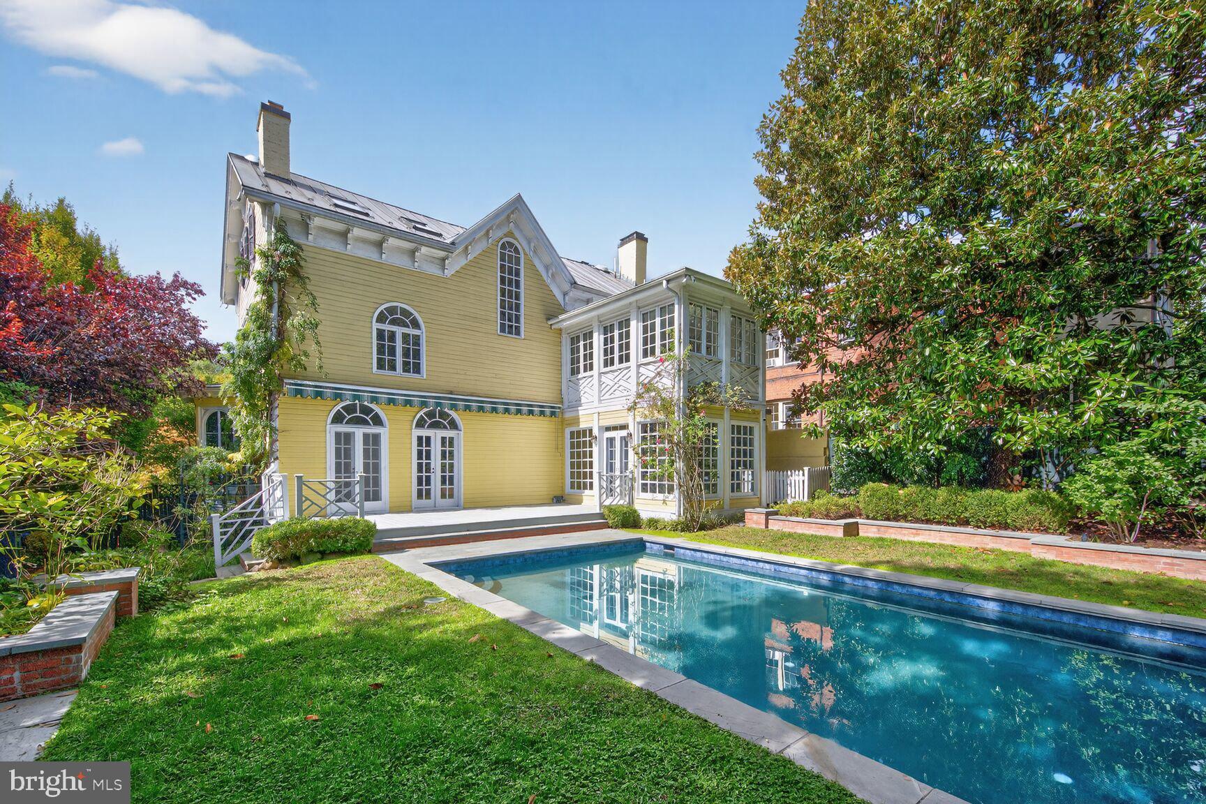 1545 35th Street Northwest Washington, DC 20007 - Photo 4 of 65 a front view of a house with swimming pool and porch