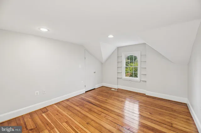 a view of a park with large trees