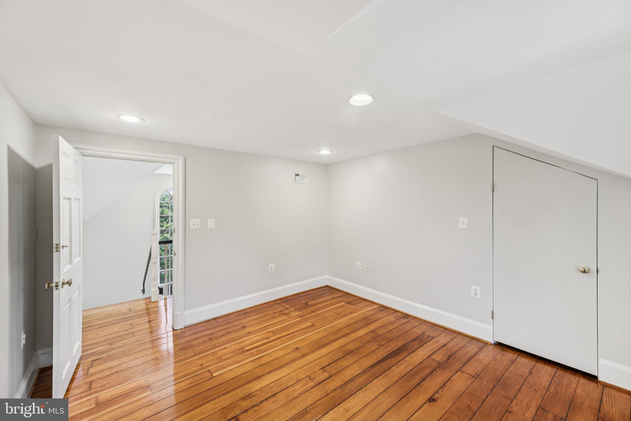 1545 35th Street Northwest Washington, DC 20007 - Photo 51 of 65 a view of empty room with wooden floor