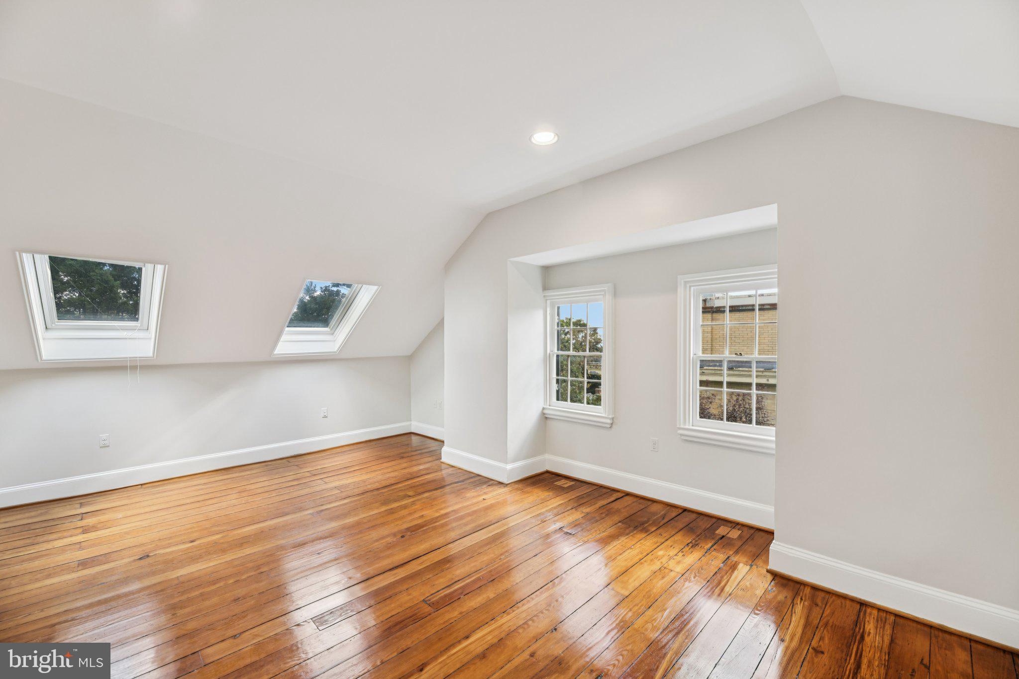 1545 35th Street Northwest Washington, DC 20007 - Photo 53 of 65 an empty room with wooden floor and windows