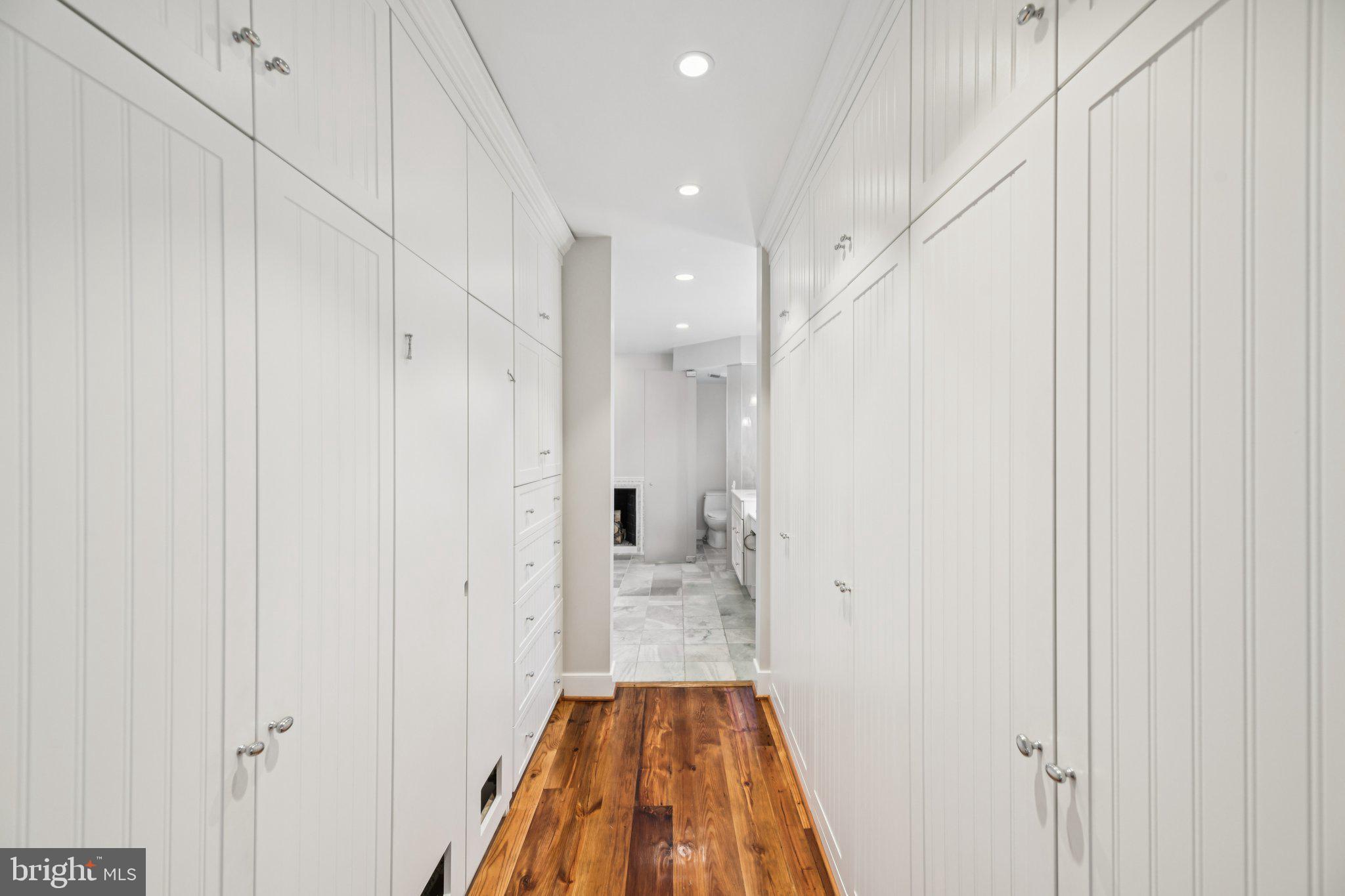 1545 35th Street Northwest Washington, DC 20007 - Photo 57 of 65 a view of a hallway with wooden floor and a bathroom