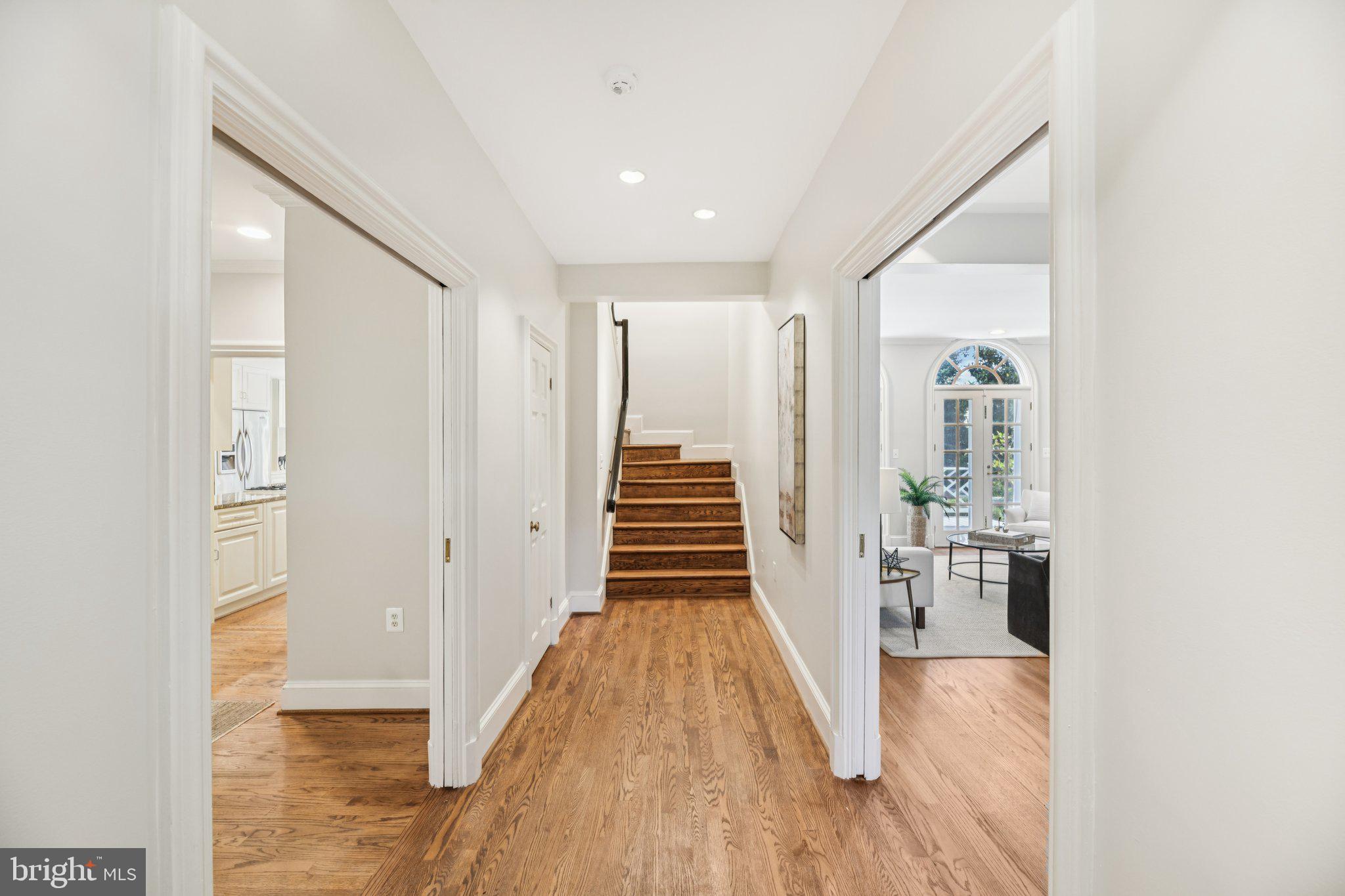 1545 35th Street Northwest Washington, DC 20007 - Photo 7 of 65 a view of a hallway with wooden floor and staircase