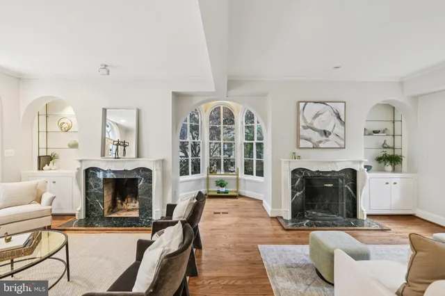 a living room with furniture rug and window